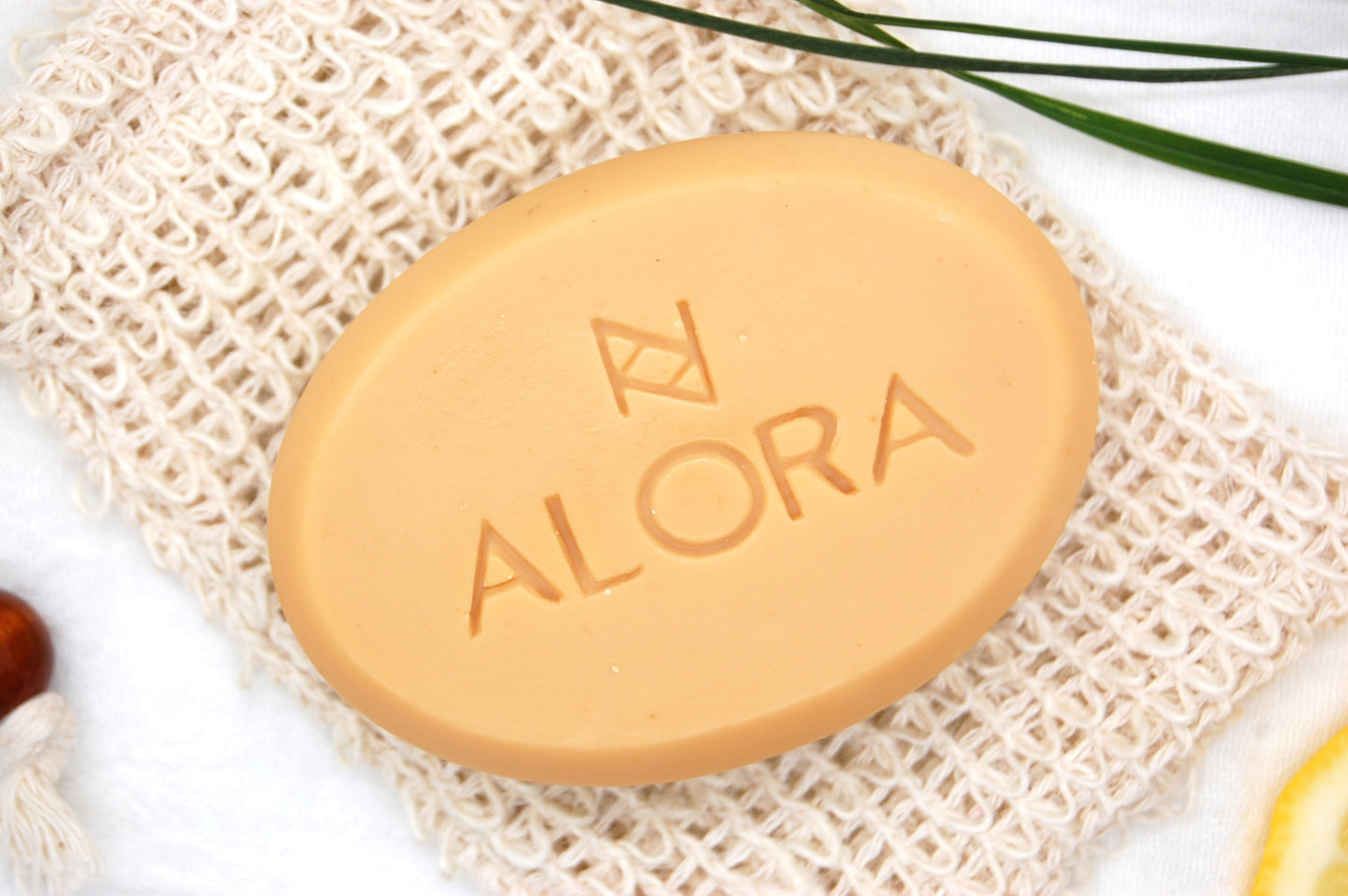 Close up of AloraCo Lemongrass bar soap.