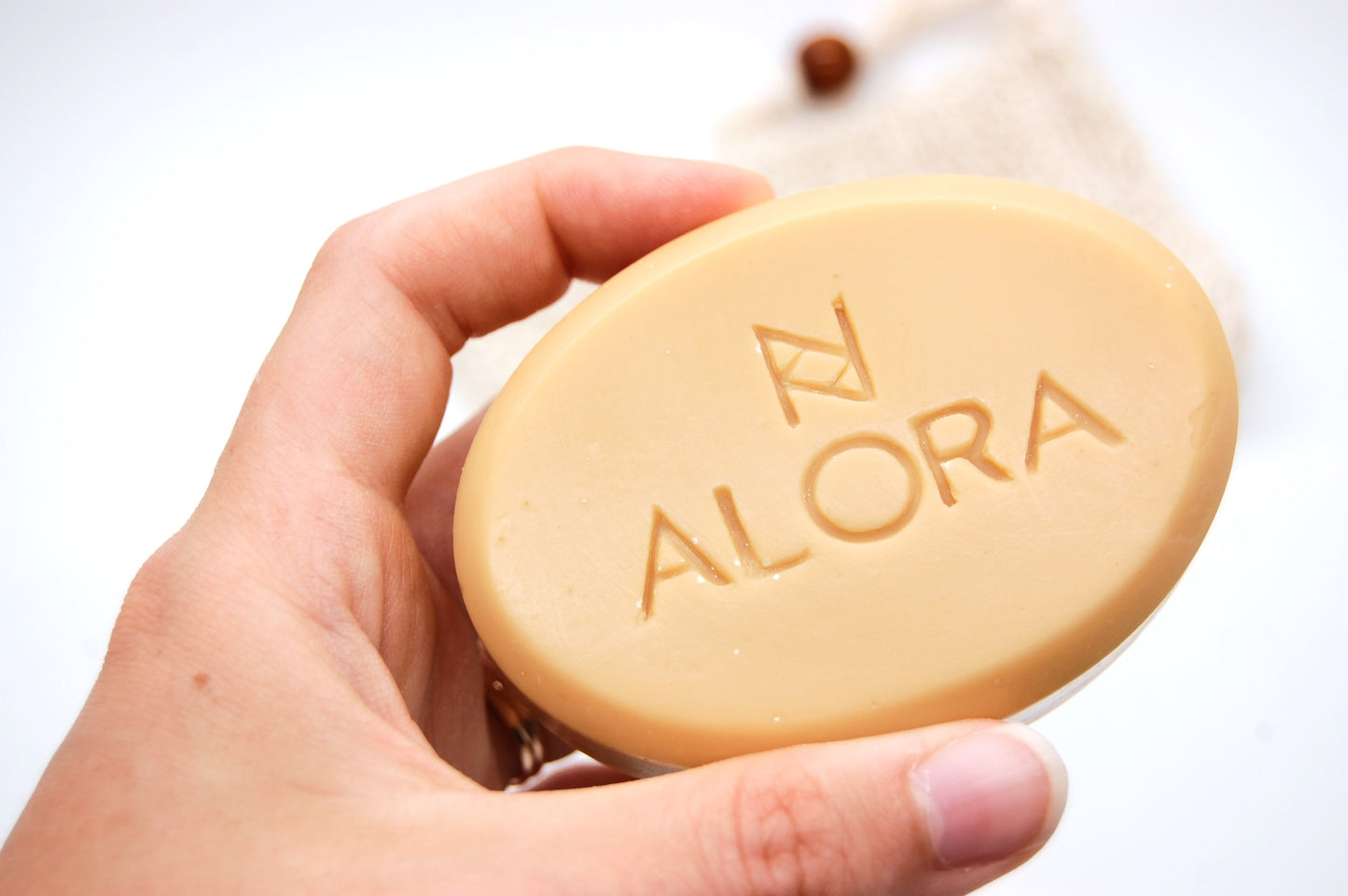 Handheld lemongrass soap product photo