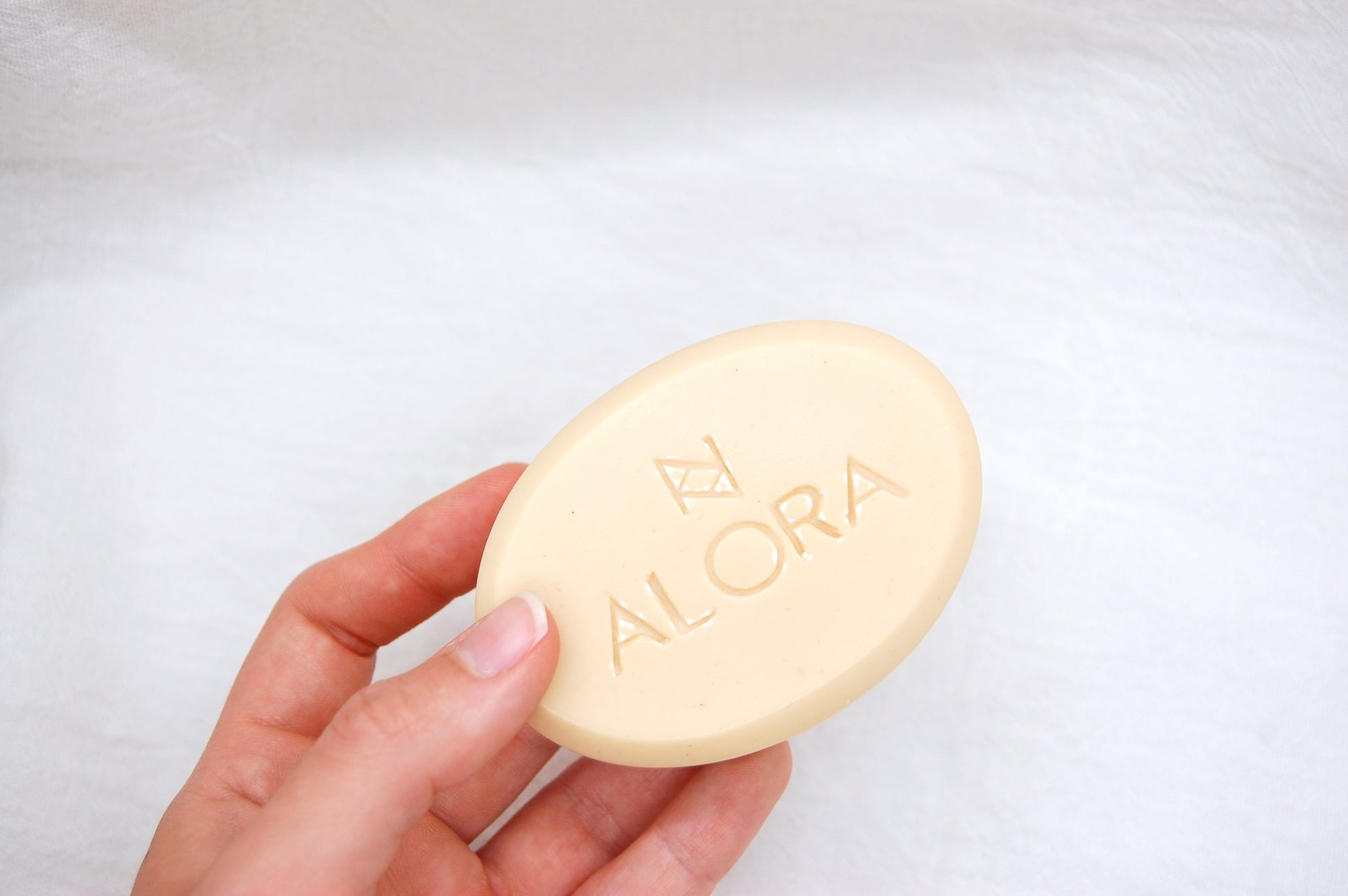 Alora Unscented Bar Soap. Size display of our all natural bar soap.